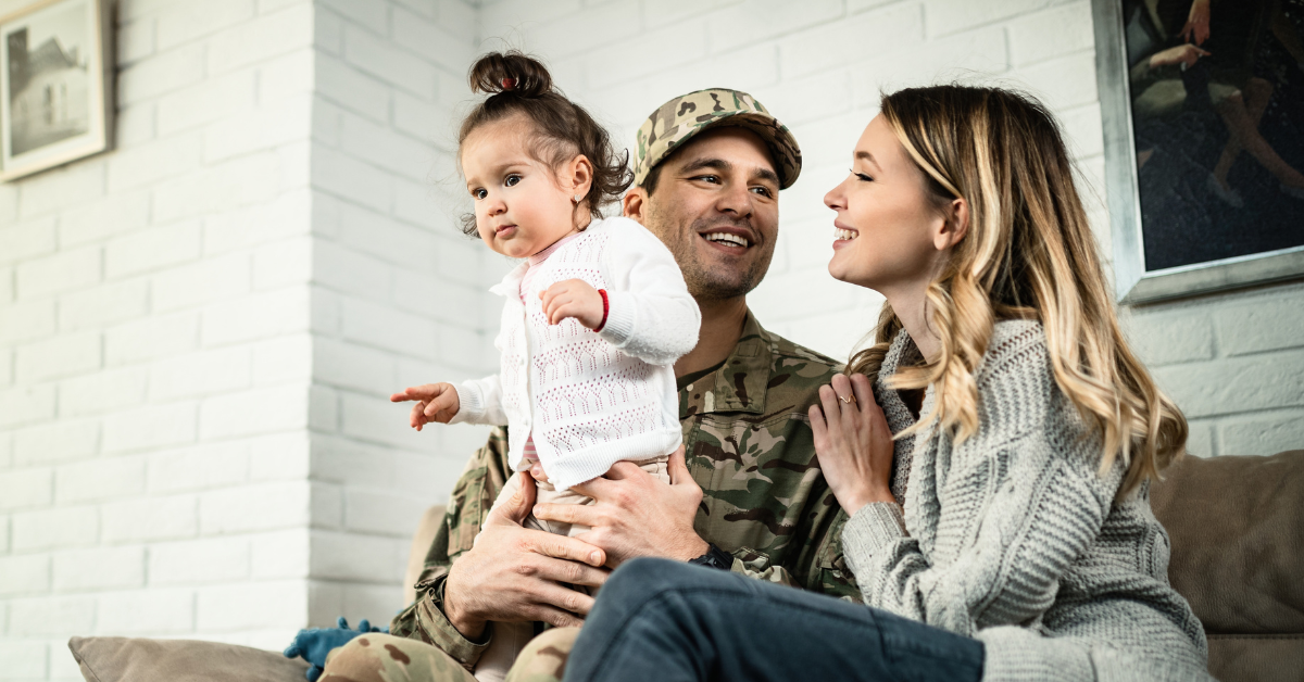 military family with kid sitting on front porch