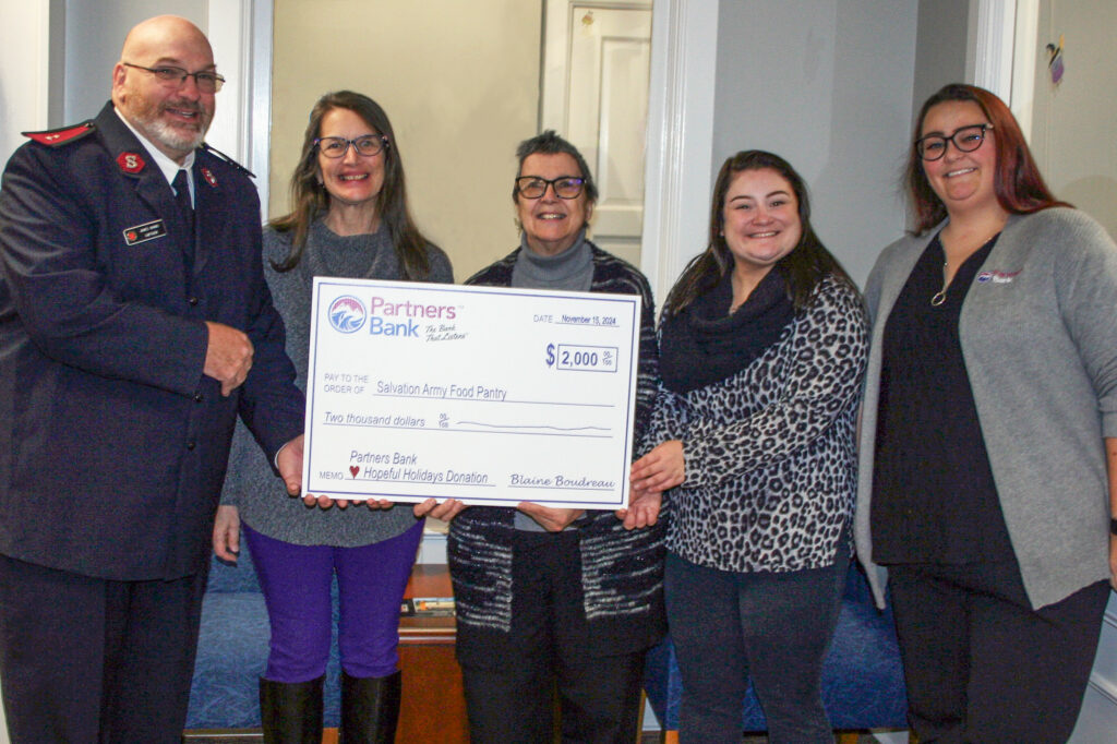 Partners Bank team members donating a check to a local food pantry.